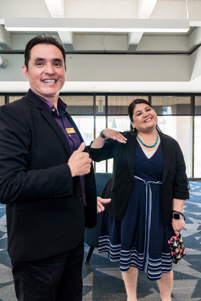 Sr. Program Coordinator Eric Hardy and Assistant Libarian and Archivist Vina Begay smiling into camera during Grand Opening luncheon